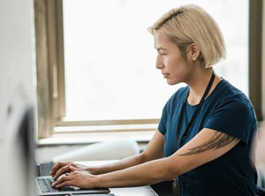 A practice administrator using a computer